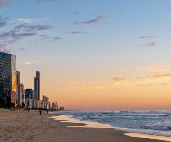 Landscape of Gold Coast beach at sunrise, with buildings